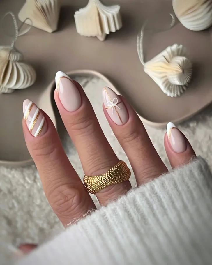 Elegant Christmas Nail Art in White and Gold