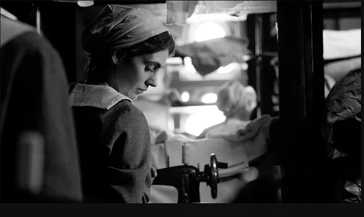 https://www.biographygen.com/wp-content/uploads/2025/07/The-GIrl-With-The-Needle-Movie-Review.png